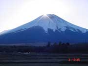 sunset sits on mt. fuji, sparkling like a diamond