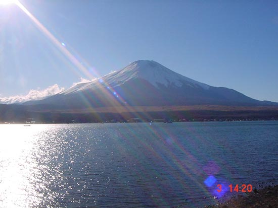 rainbow mt. fuji, sunray strikes across mt. fuji and lake yamanakako showing a rainbow color