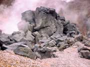 charred remains of a rock at owakudani after volcanic eruption